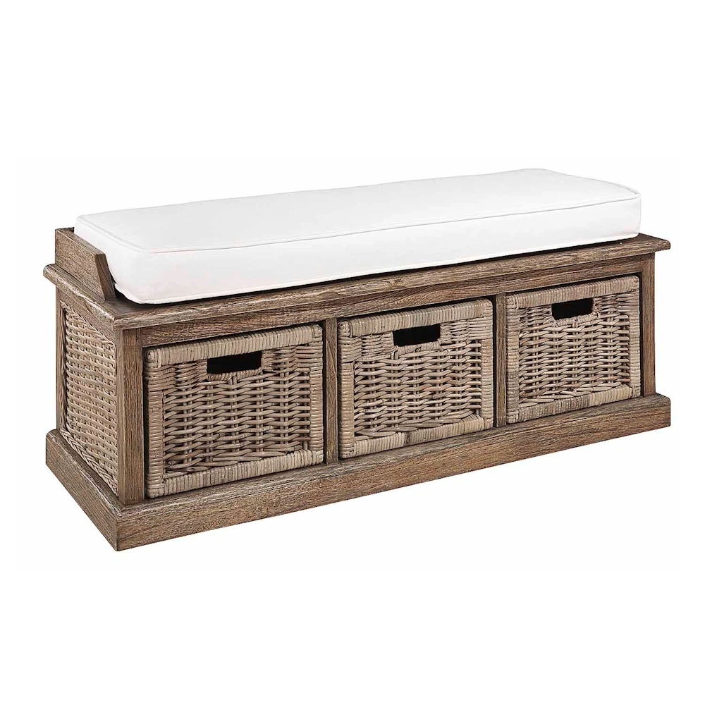 Wooden window seat with light coloured seat cushion and 3 rattan drawers.